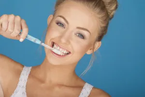 person brushing their teeth